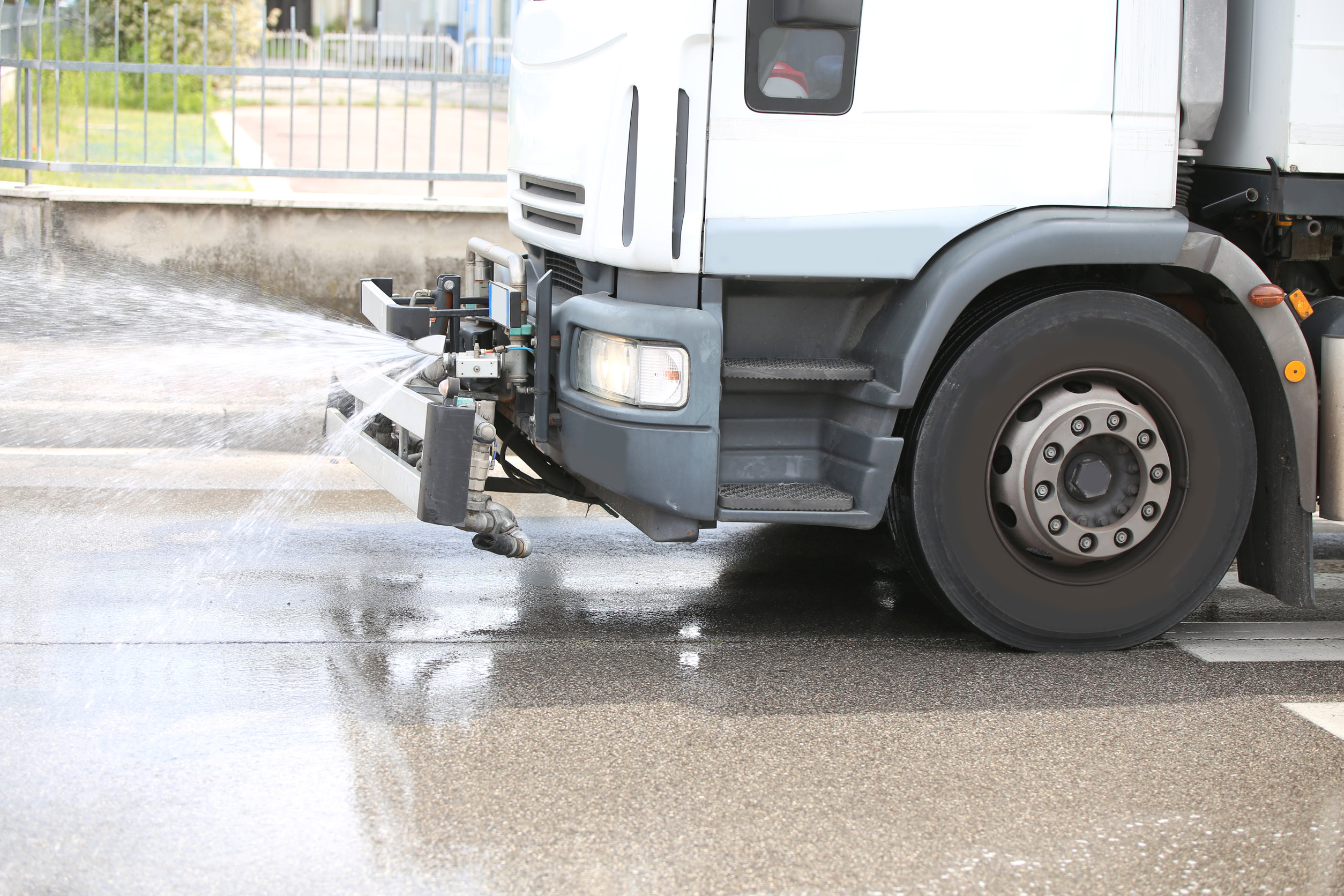 road cleaning trucks during asphalt washing in the city